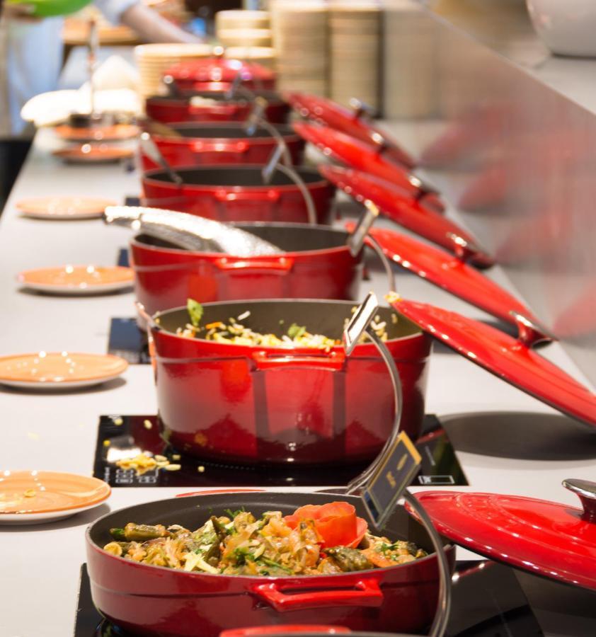 The Act Hotel Sharjah Exterior photo Le Creuset cookware
