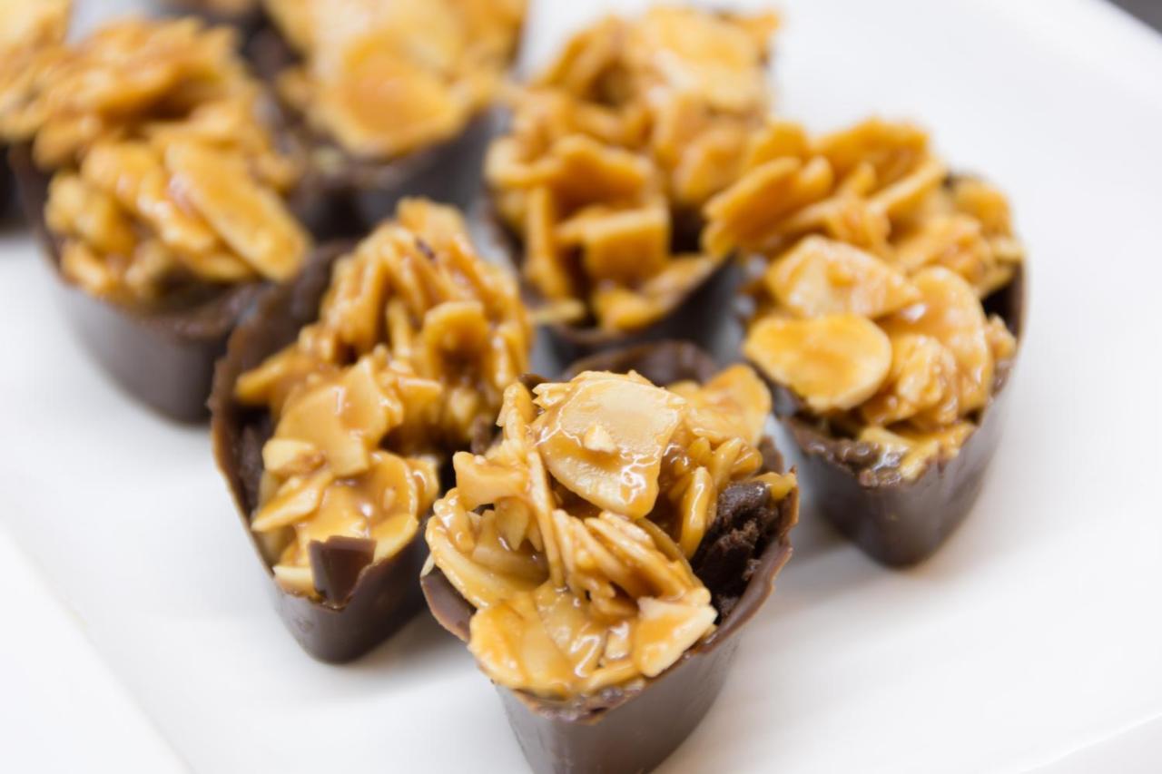 The Act Hotel Sharjah Exterior photo Peanut brittle in chocolate