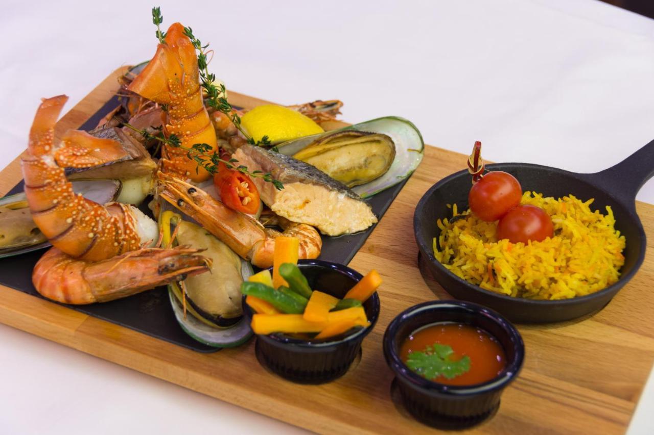 The Act Hotel Sharjah Exterior photo Seafood platter