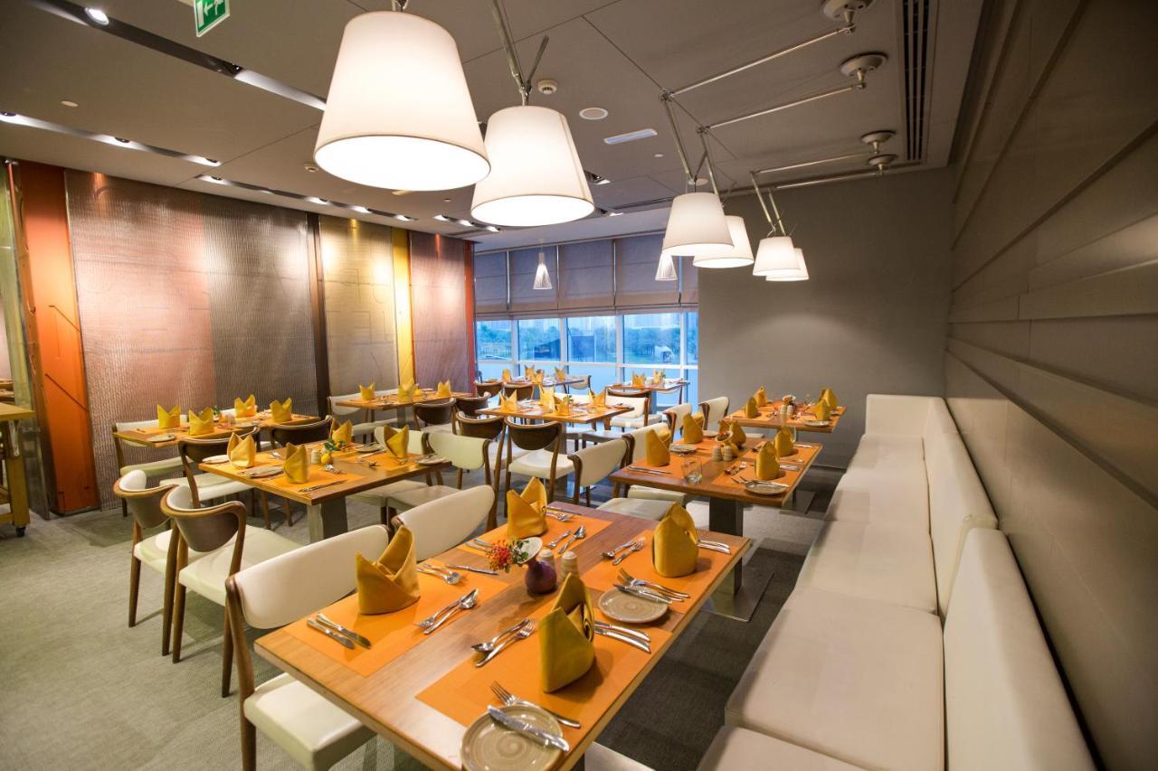 The Act Hotel Sharjah Exterior photo The interior of the restaurant