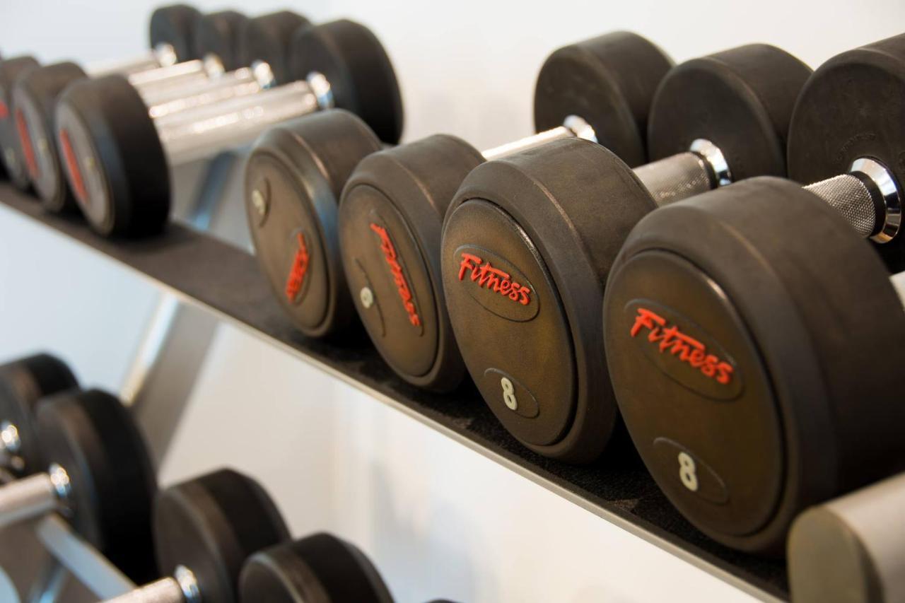 The Act Hotel Sharjah Facilities photo Dumbbells on a rack