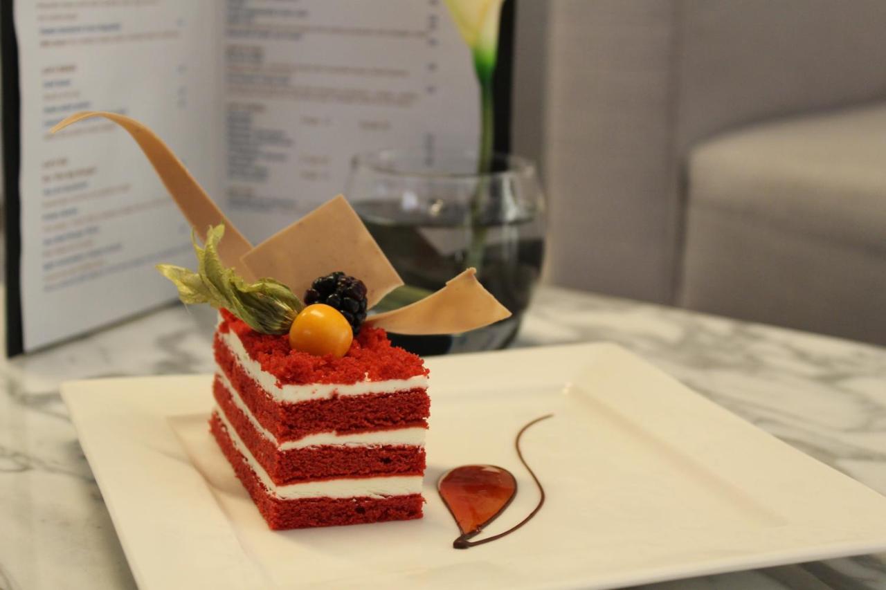 The Act Hotel Sharjah Exterior photo A red velvet cake