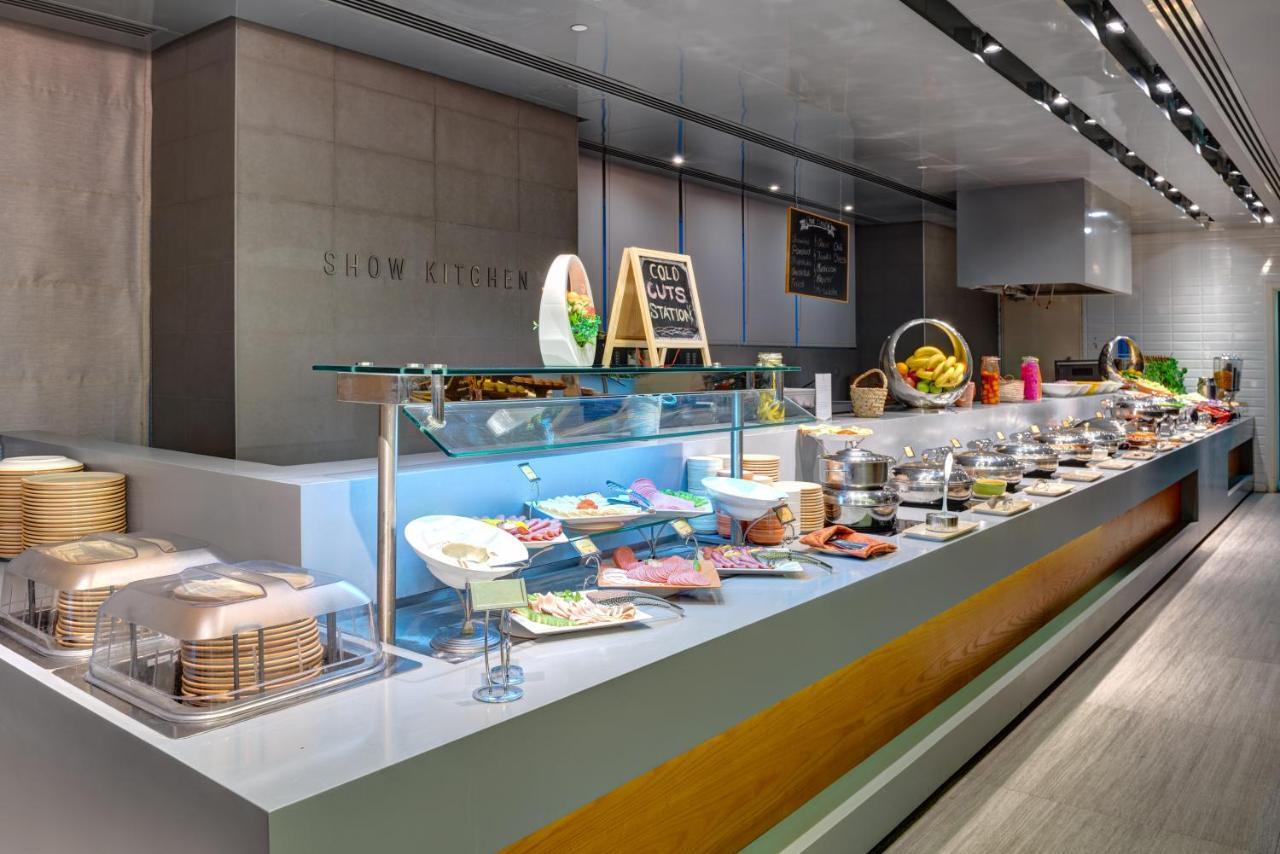 The Act Hotel Sharjah Exterior photo A buffet at a hotel