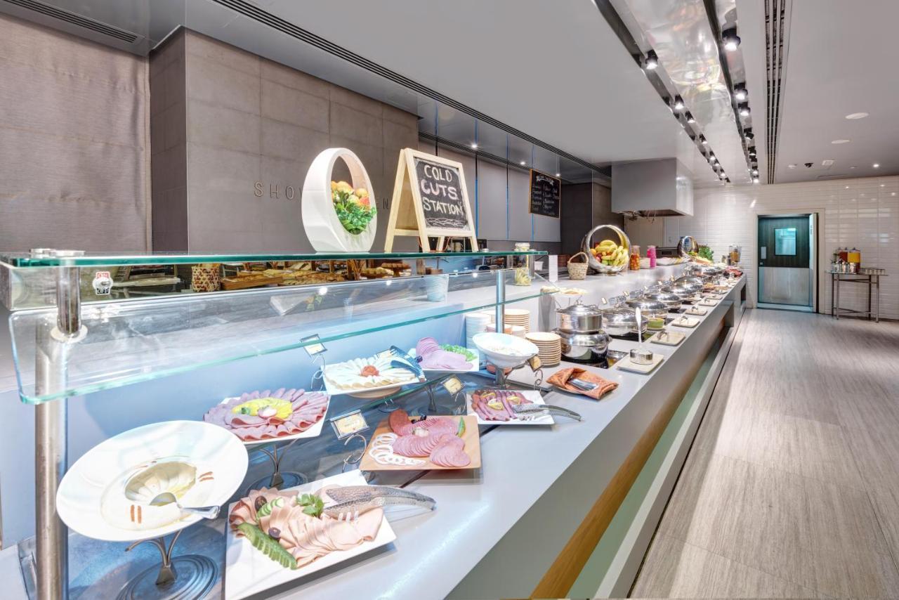 The Act Hotel Sharjah Exterior photo A buffet at a hotel